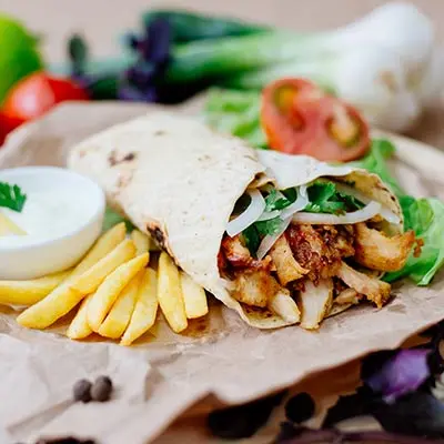 chicken-shawarma-wrap-petra-tampa.jpg Chicken shawarma wrap with fries and vegetables at Petra Tampa