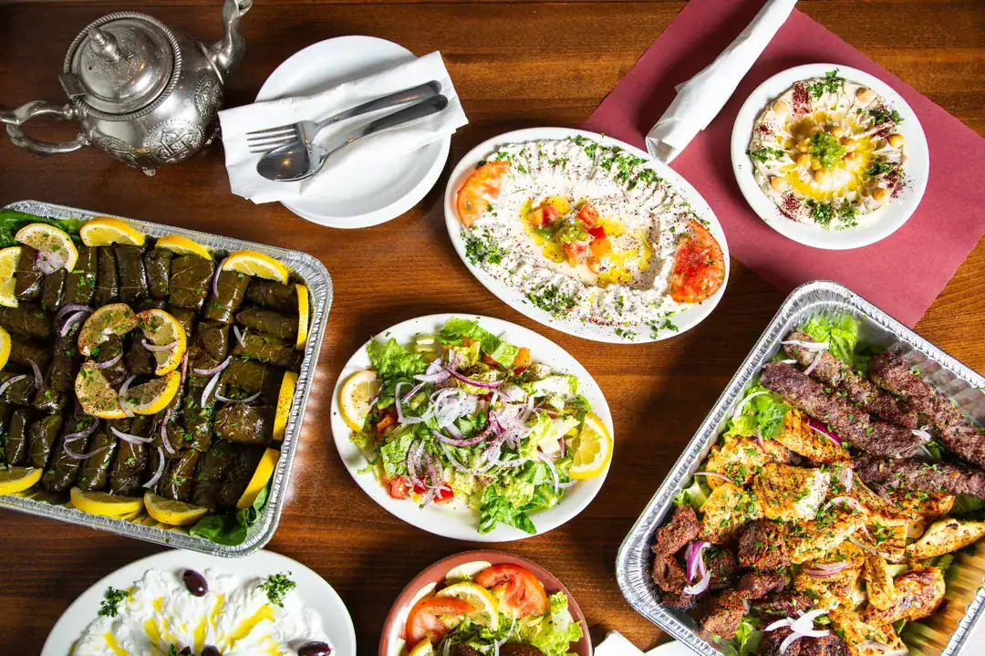 Authentic Mediterranean food platter with hummus, tabouleh, falafel, grilled meats, and salads from Petra Restaurant in Tampa