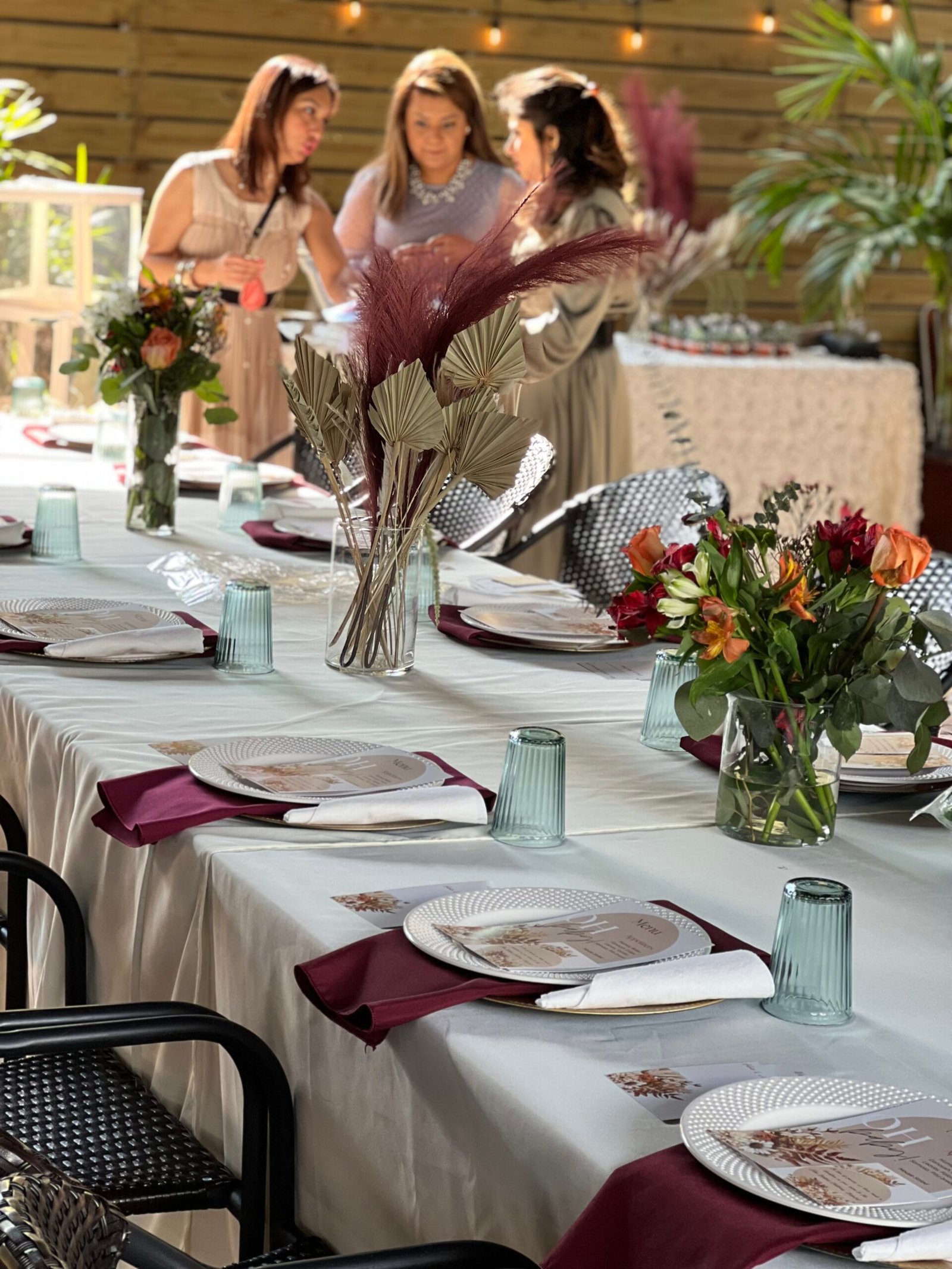 Baby shower table with floral centerpiece at Petra