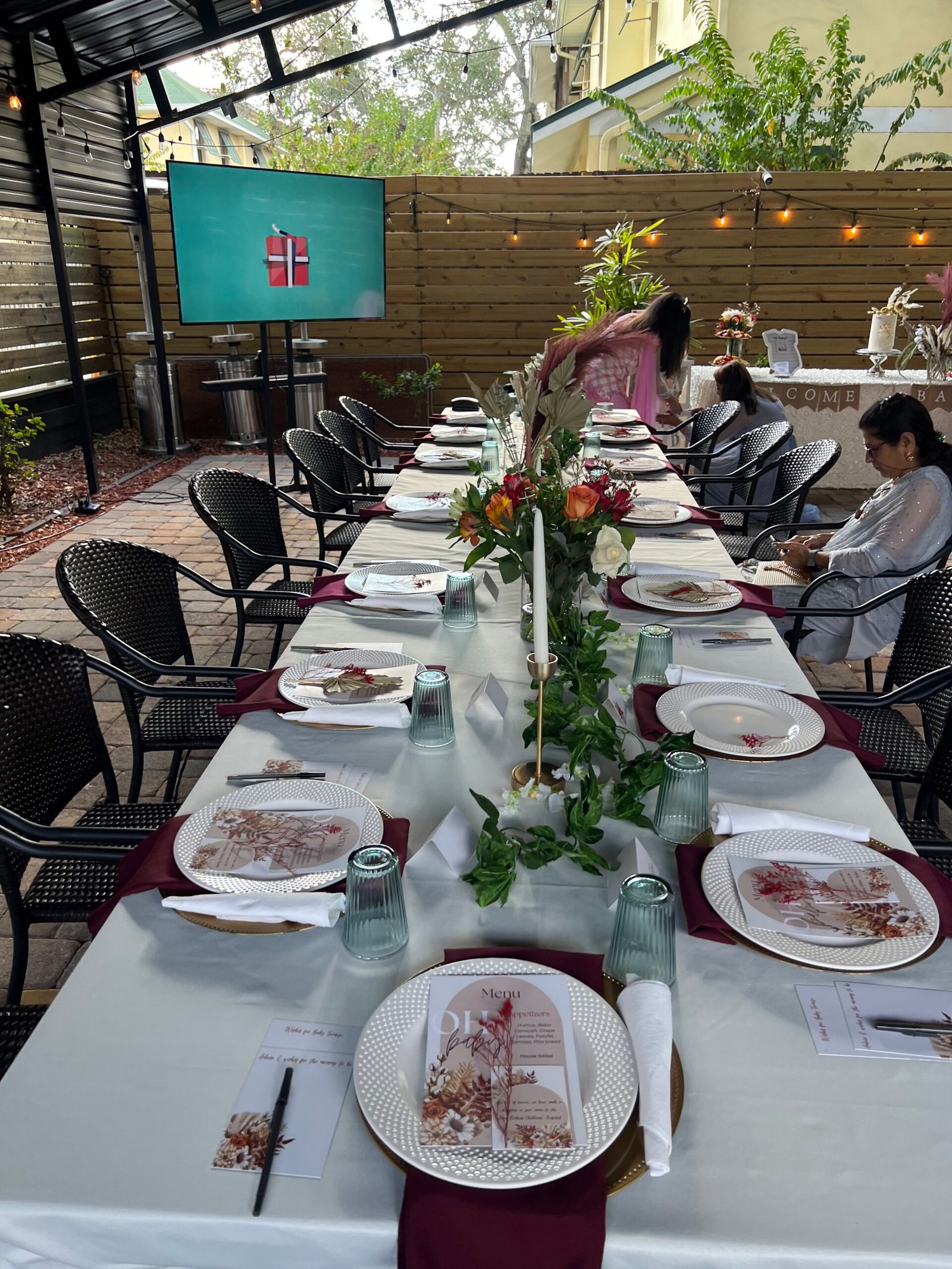 A long table set for a private dining event catered by Petra in Tampa