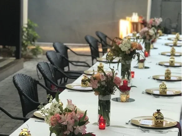Event table with floral centerpieces at Petra Mediterranean catering Tampa Kennedy Blvd FL